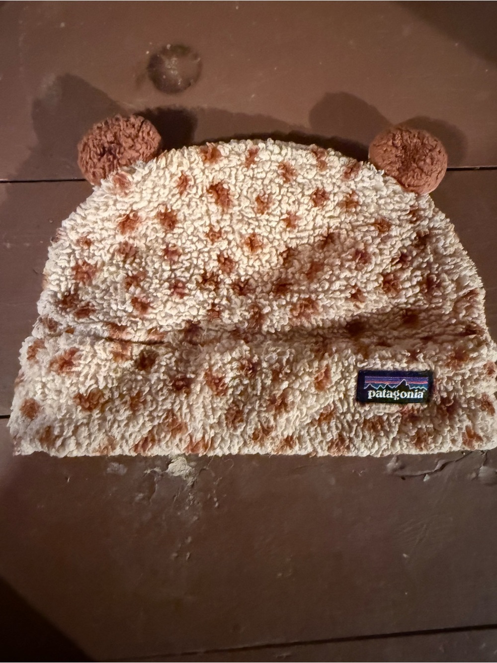 Patagonia Cream Sherpa Beanie with Brown Pom Accents